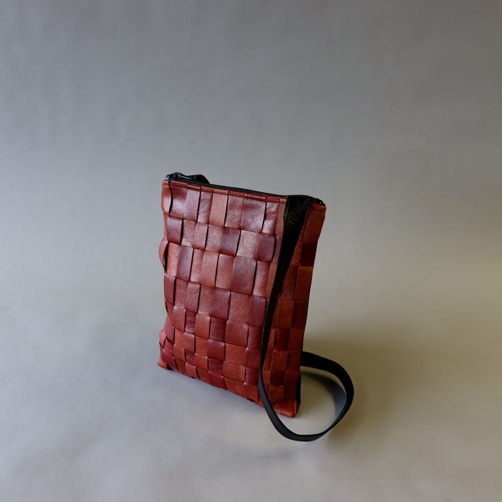 Red handwoven leather bag
